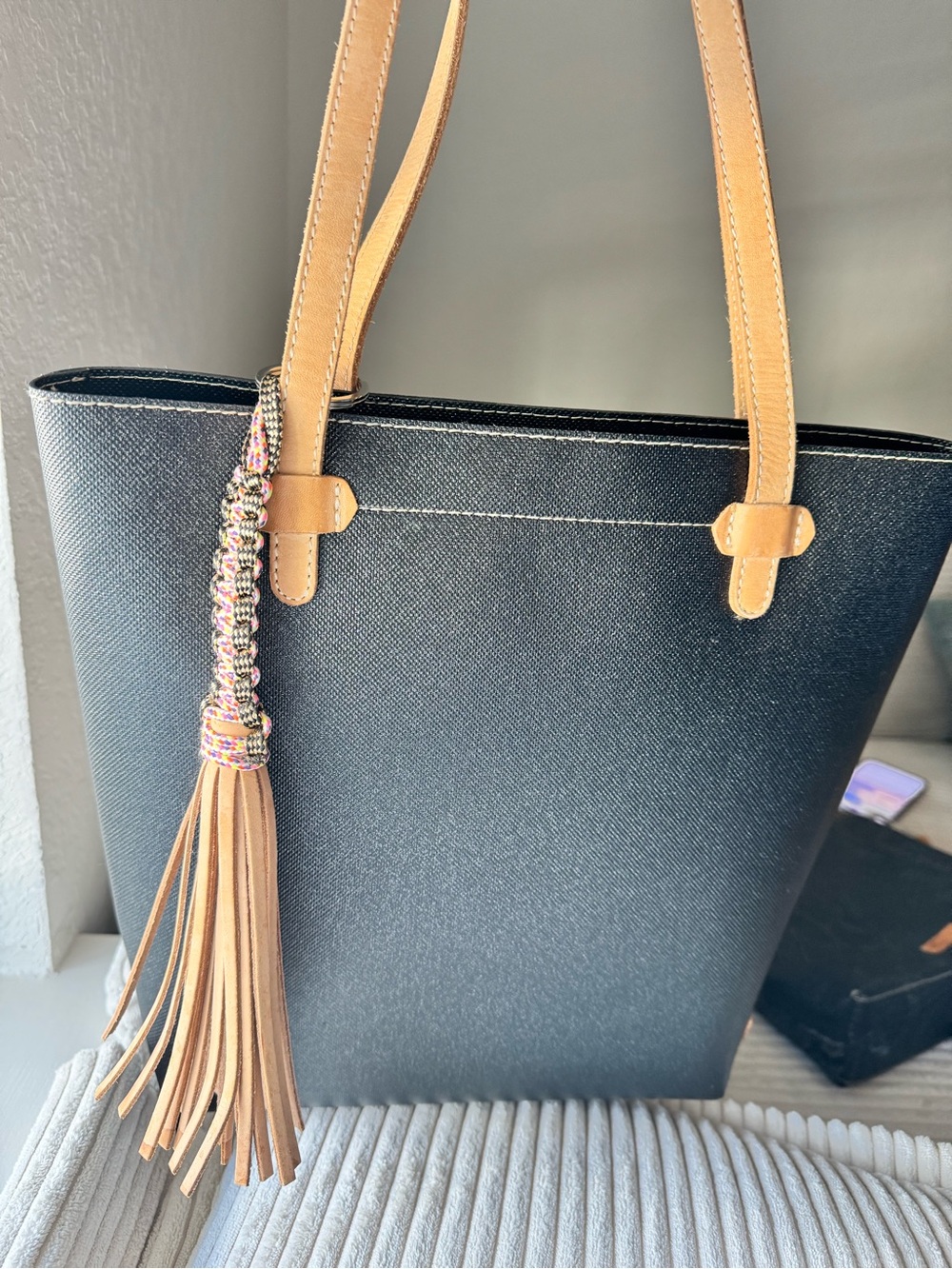 Consuela Black Tote with Tan Straps and Tassel Charm